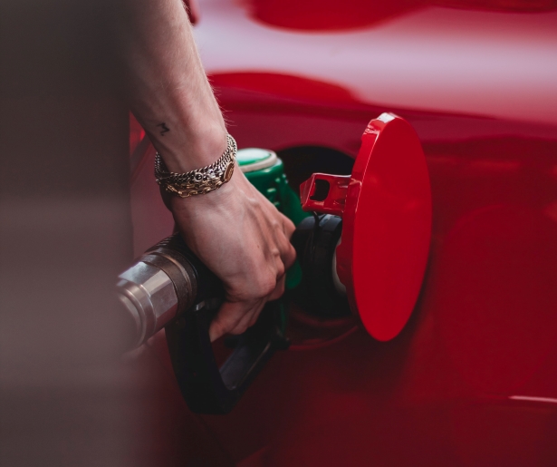 Person putting fuel in